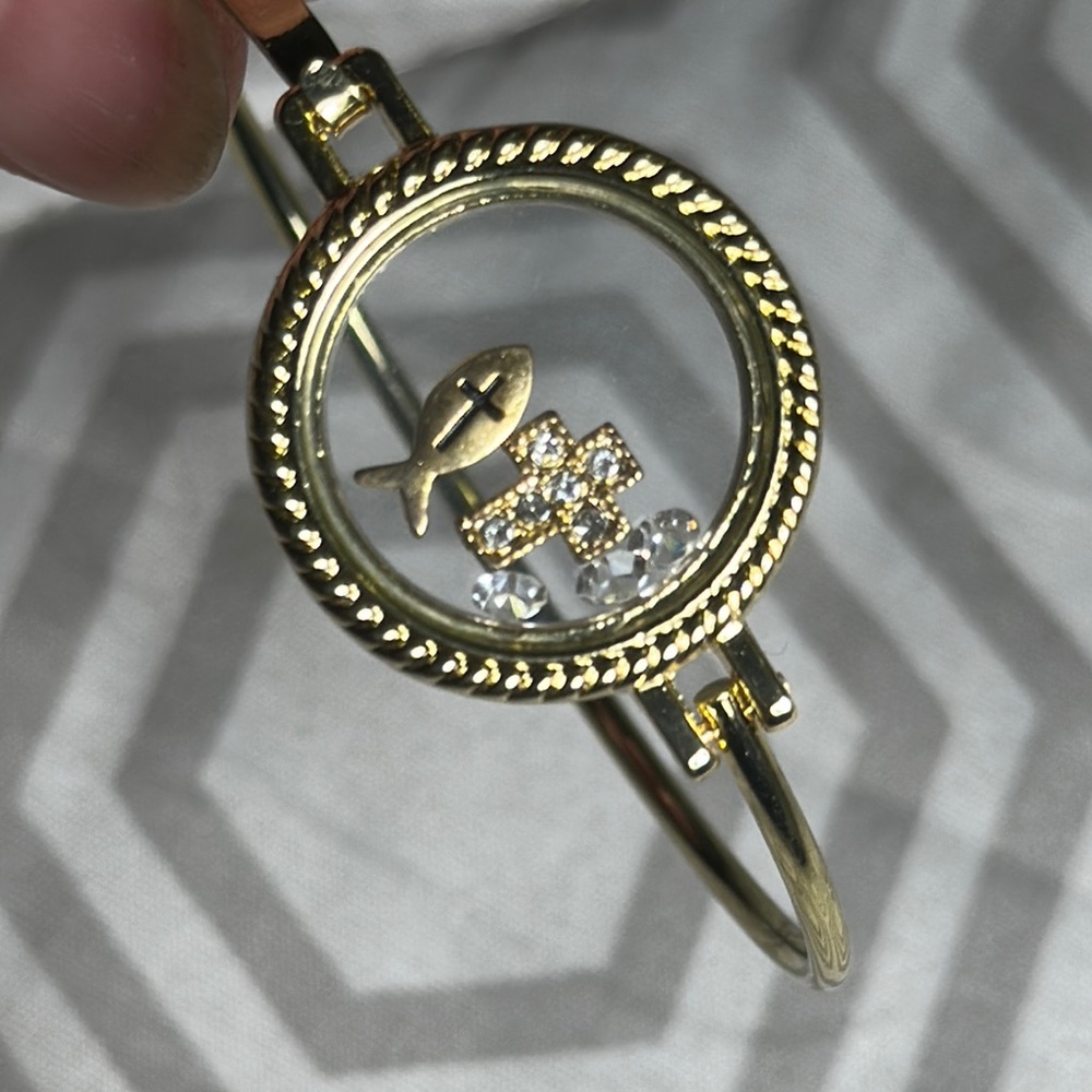 Gold and Silver Bracelet with Fish and Cross Design in glass encasing